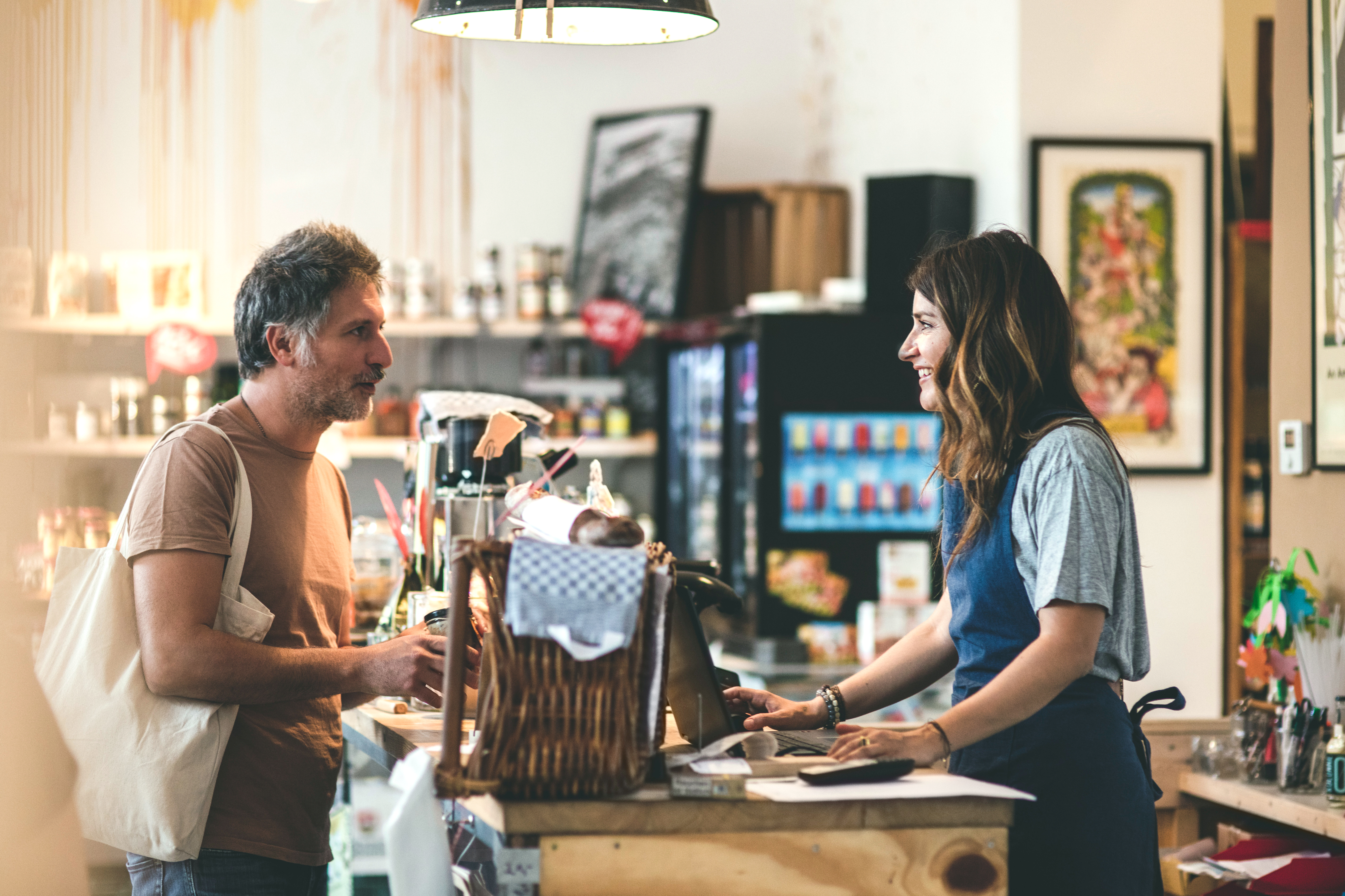 Photo of a small business manager helping a customer