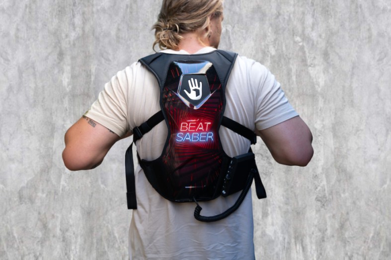 Photo of a man wearing a Beat Saber SUBPAC