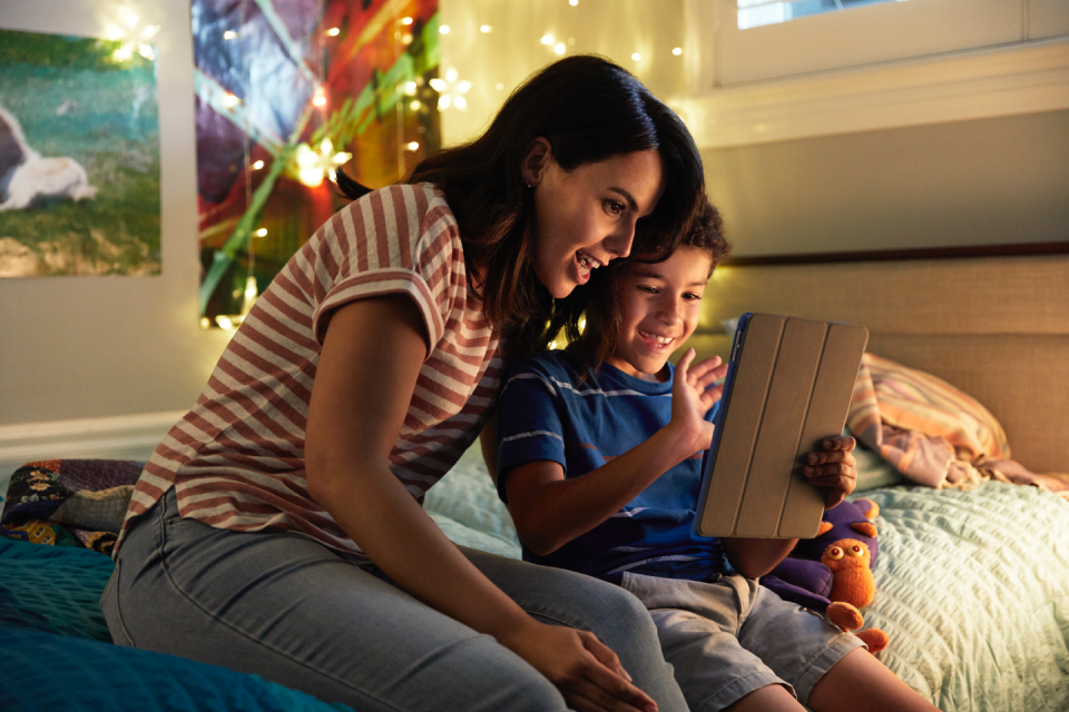 Photo of a child and parent using Messenger Kids