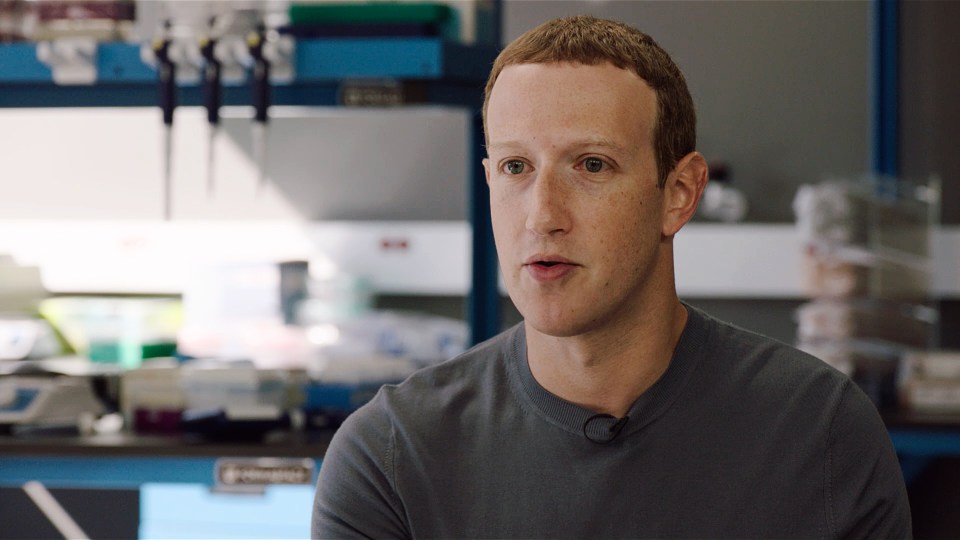 Mark Zuckerberg speaking in a lab