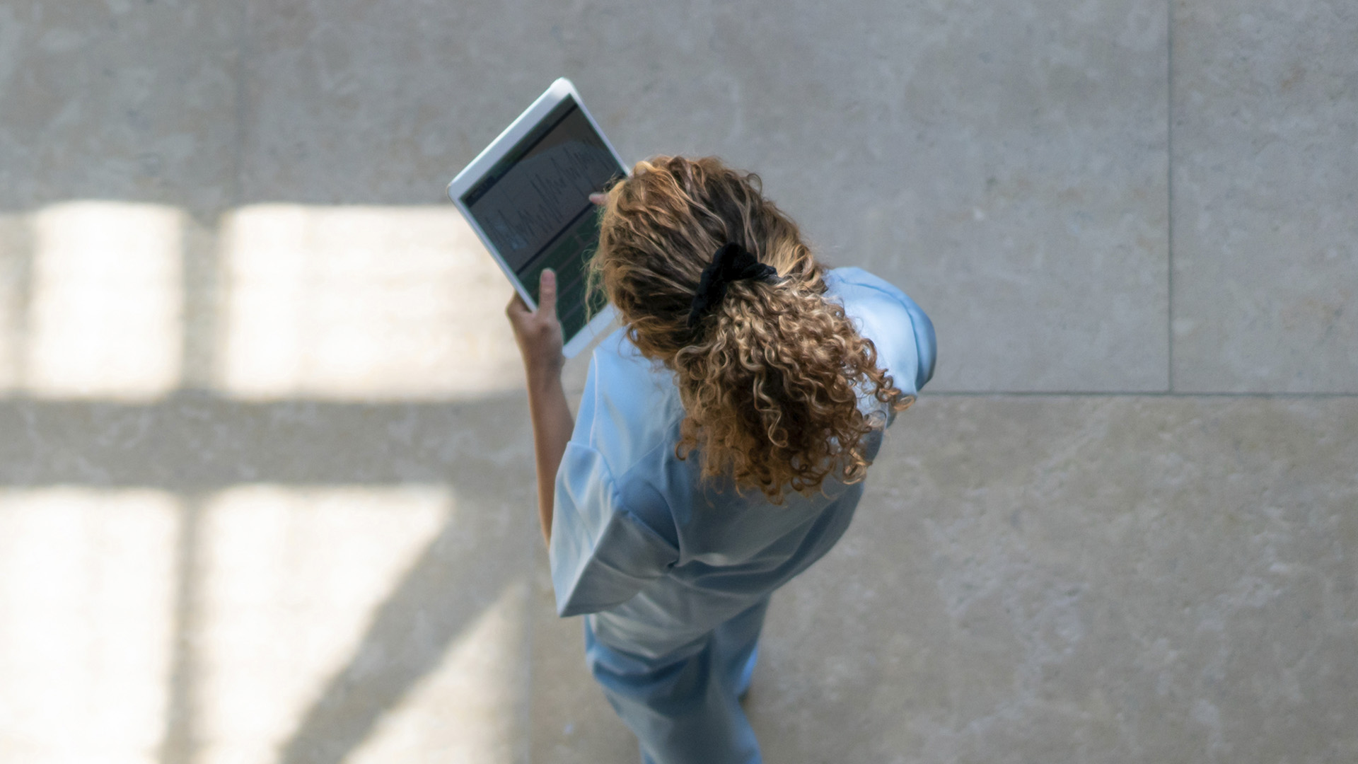 Photo of a medical professional using a tablet