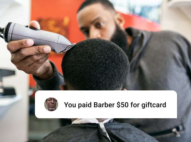 Barbershop customer getting haircut with gift card UI overlay