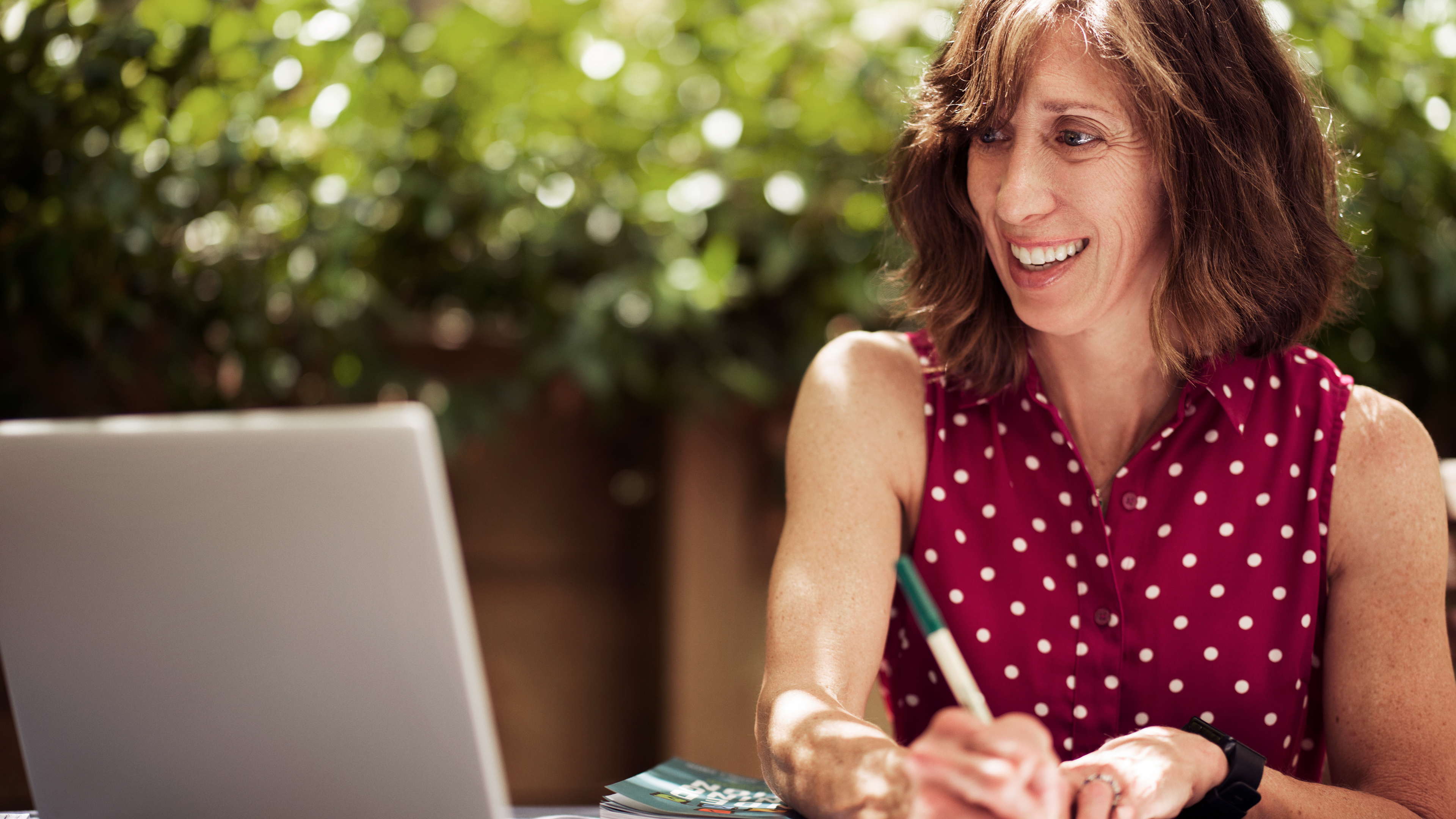Woman teaching class by computer