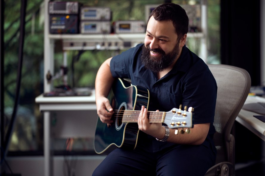 Research Scientist Pablo Hoffmann plays guitar