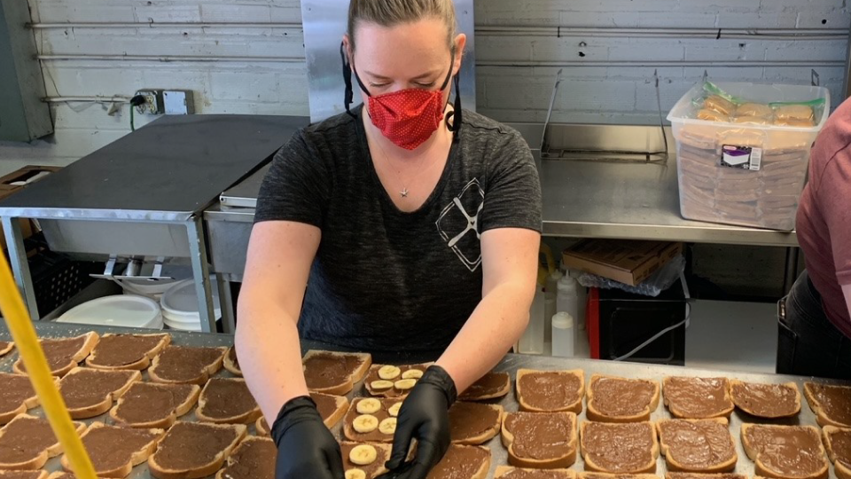 Photo of a woman making sandwiches