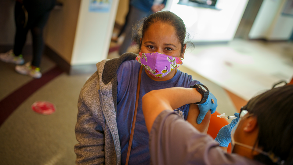 Photo of a woman getting a COVID-19 vaccine