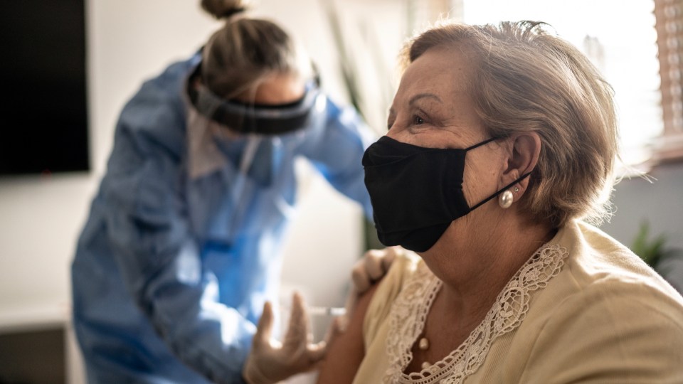 Photo of a woman getting a COVID-19 vaccine