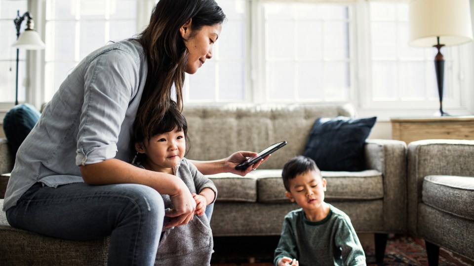 Image of woman and two children
