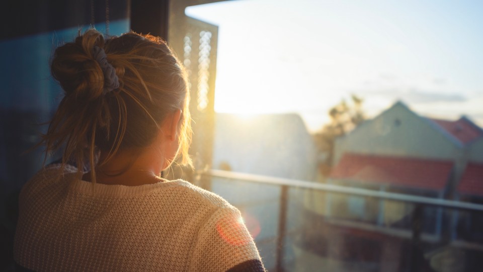 Image of a girl looking outside