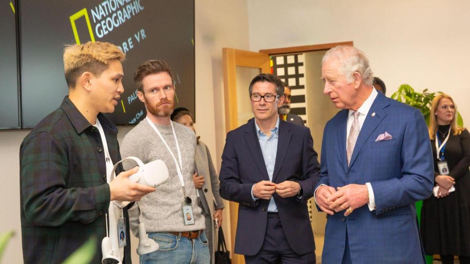 Prince Charles speaking with three people about Meta Quest 2