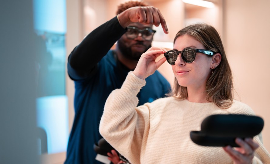 Image of woman trying Ray-Ban Stories in the Meta Store