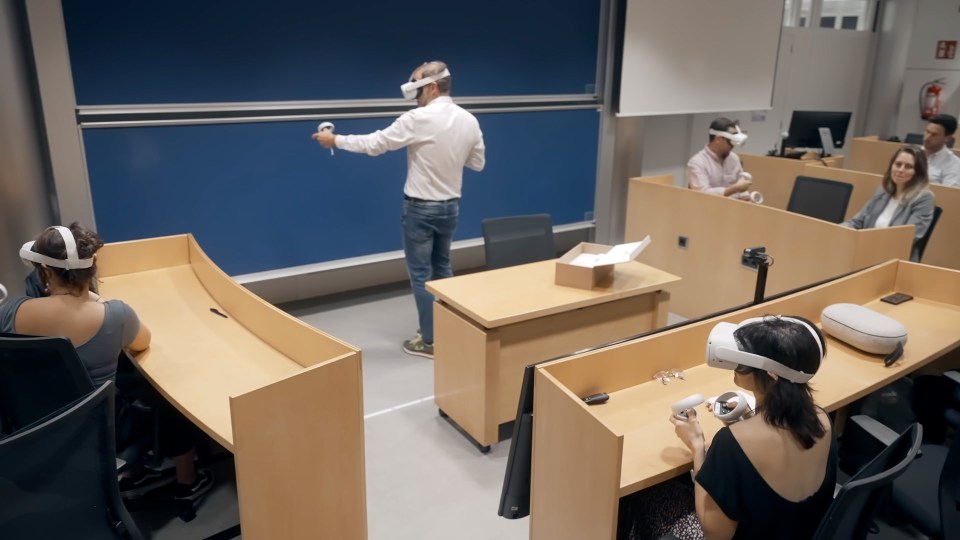 Lecturer and students in classroom wearing Meta Quest 2 headsets