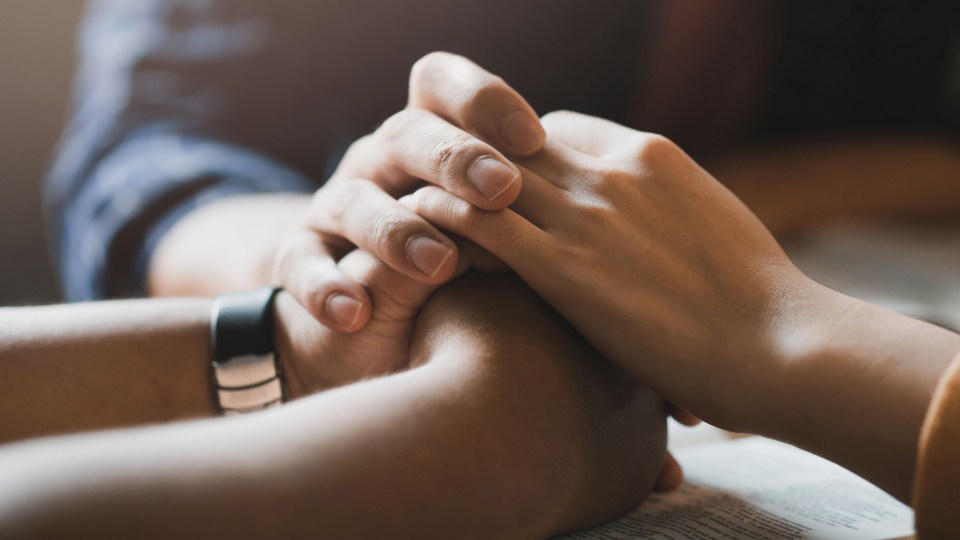 An image of two sets of hands.