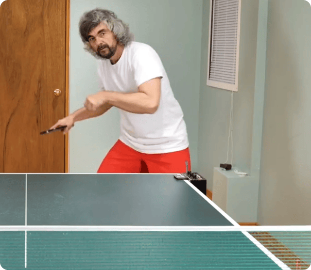 GIF of man playing ping pong, with SAM 2 highlighting his head and following it as he moves