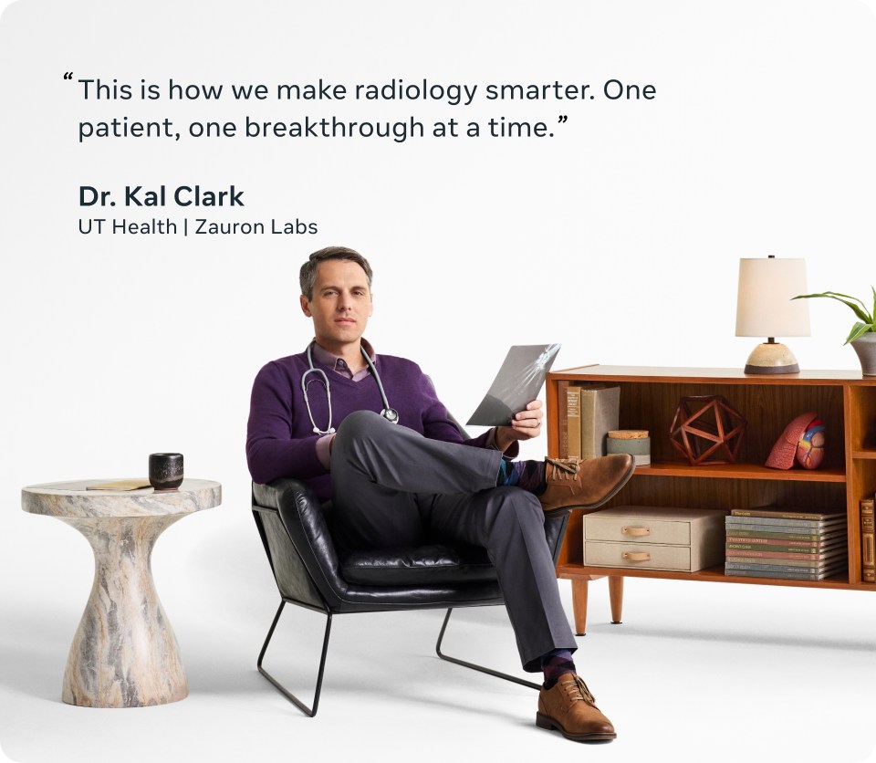 A picture of a doctor with a stethoscope sitting in a modern-looking chair. 