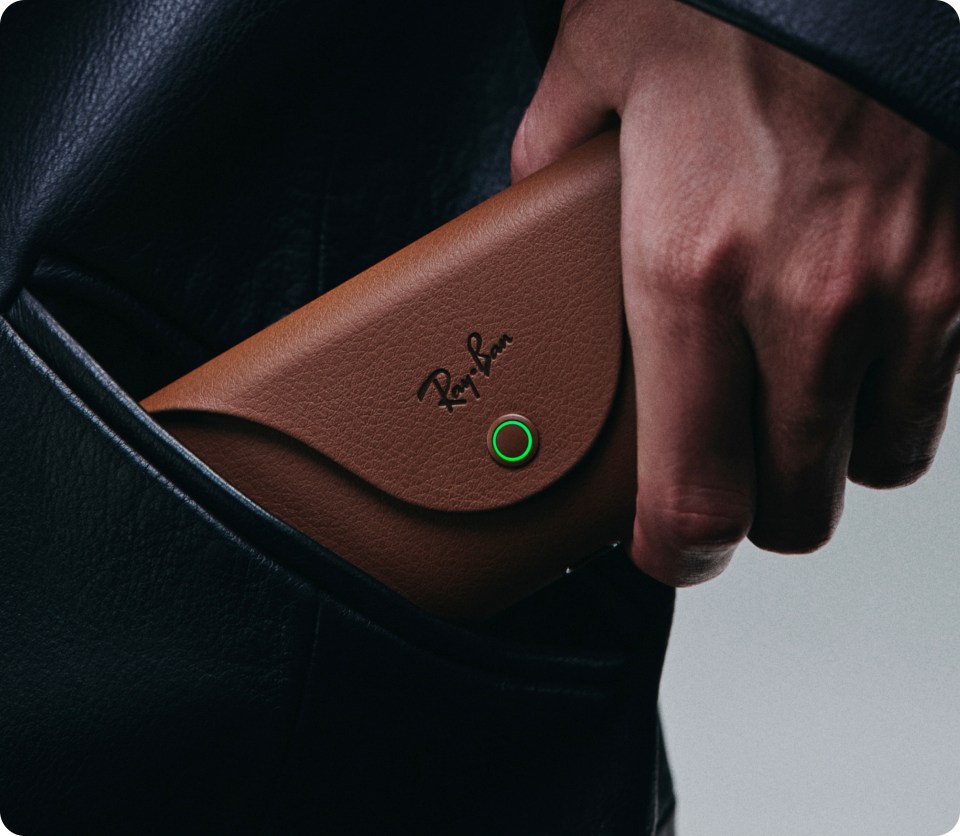 Image of charging case being pulled out of a pocket