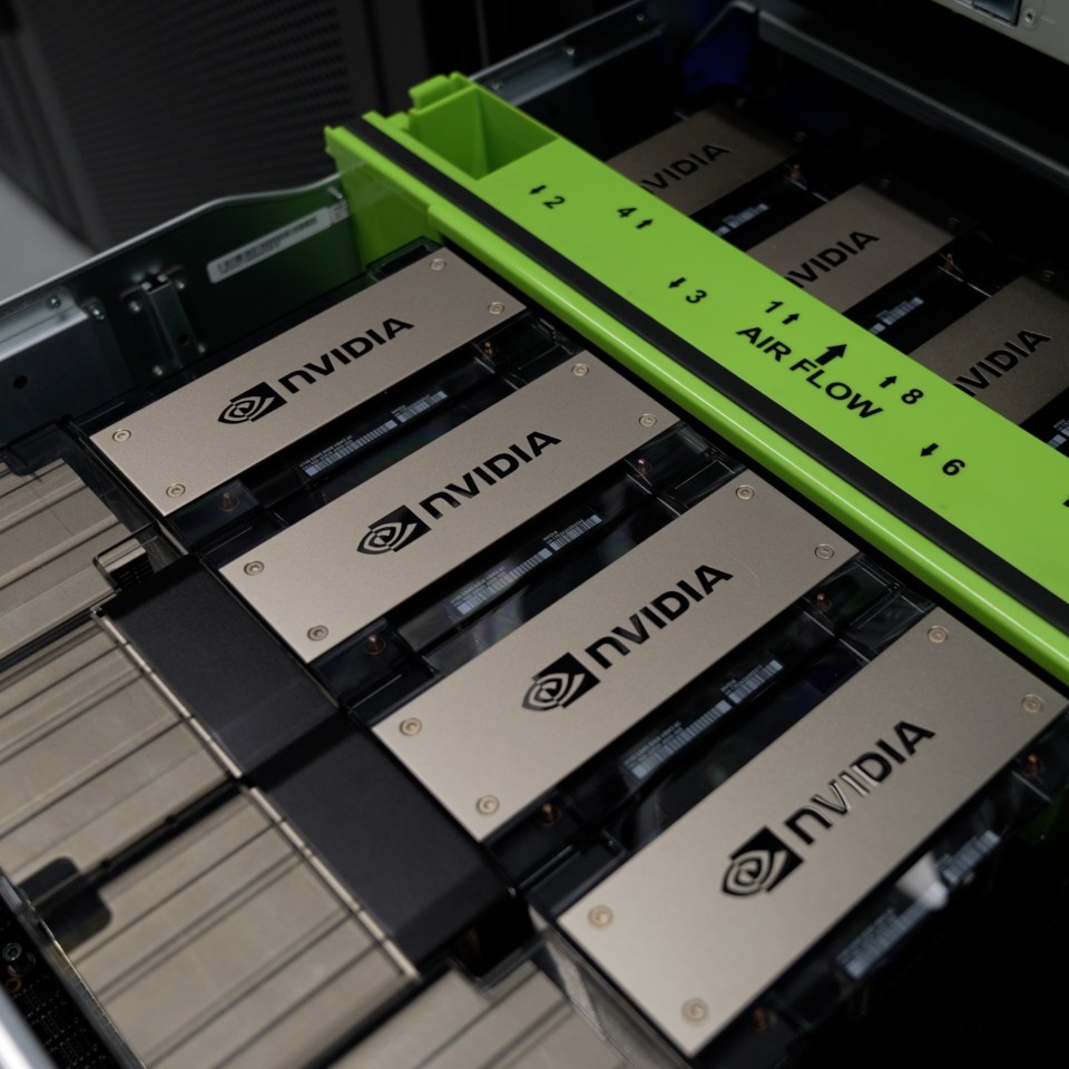 Photo of Nvidia H100s in in a server rack using air cooling