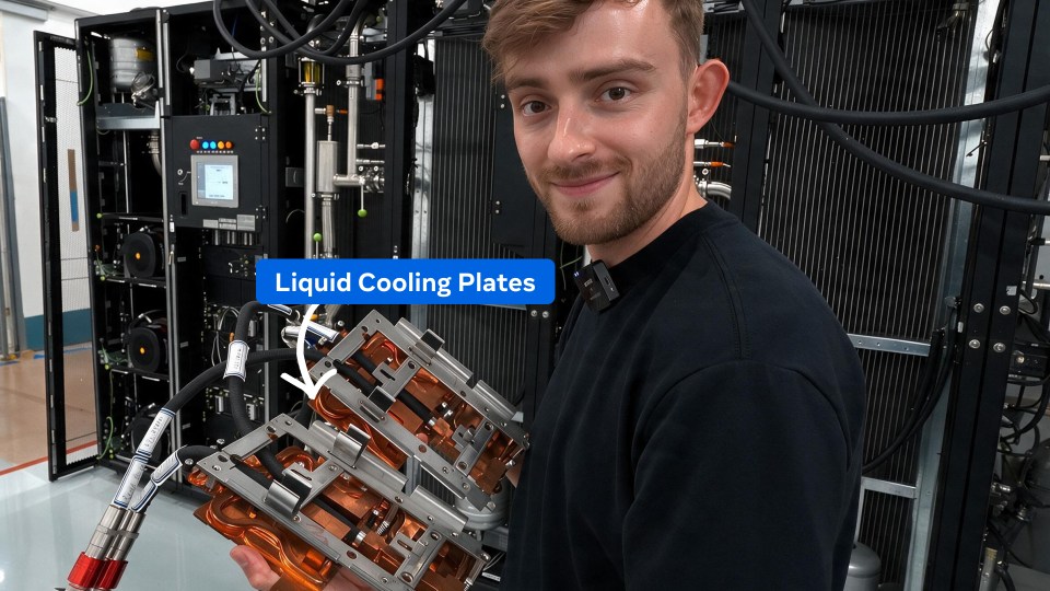 Photo of Tom Shaw holding liquid cooling plates