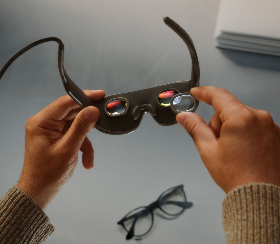Person holding Meta VR glasses
